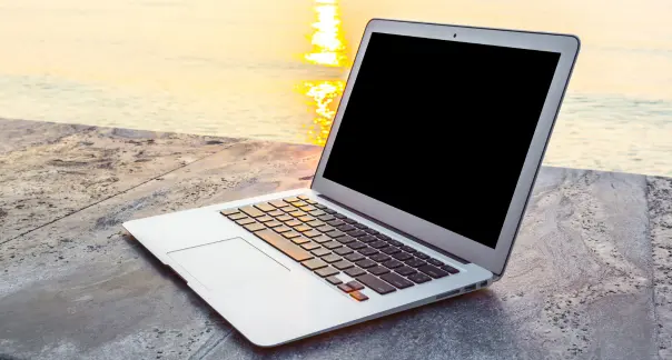 used macbook calicut in beach side with sunlight - affordabl price